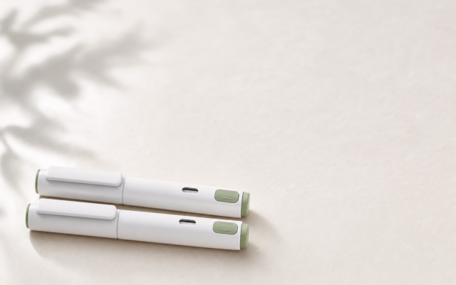 Unbranded [pillar-drug-class] injection pen on a neutral background — WeightLossInjections.com editorial hero