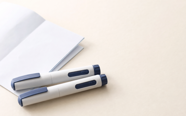 Unbranded [pillar-drug-class] injection pen on a neutral background — WeightLossInjections.com editorial hero